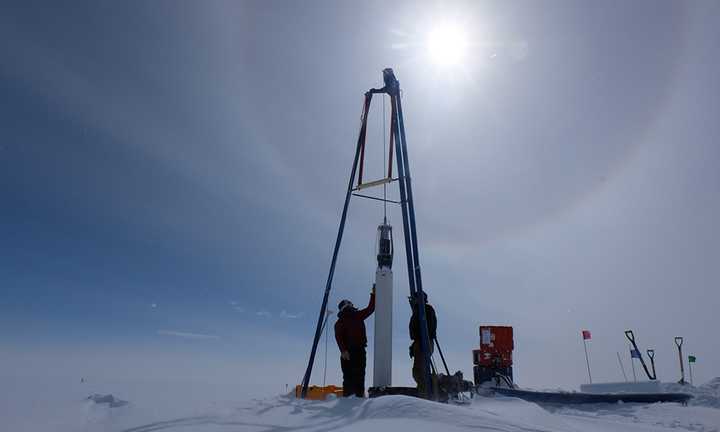 Researchers in Greenland drill for ice cores, which contain air bubbles with small quantities of ancient air trapped inside. By measuring the carbon-14 isotope in air from more than 200 years ago, the researchers found that scientists have been vastly overestimating the amount of fossil methane emitted by natural sources, and have therefore been underestimating the amount of methane humans are emitting into the atmosphere via fossil fuels. Xavier Faïn / University of Grenoble Alpes. Researchers in Greenland drill for ice cores